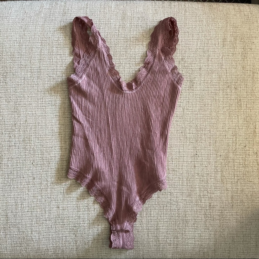 Out from under body suit